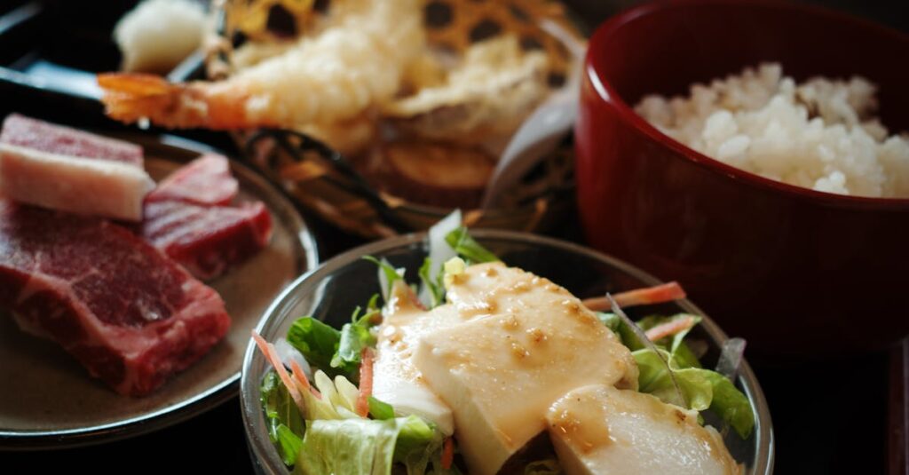 Savoring an authentic Japanese meal with fresh vegetables, rice, and tempura in a Kyoto restaurant.
